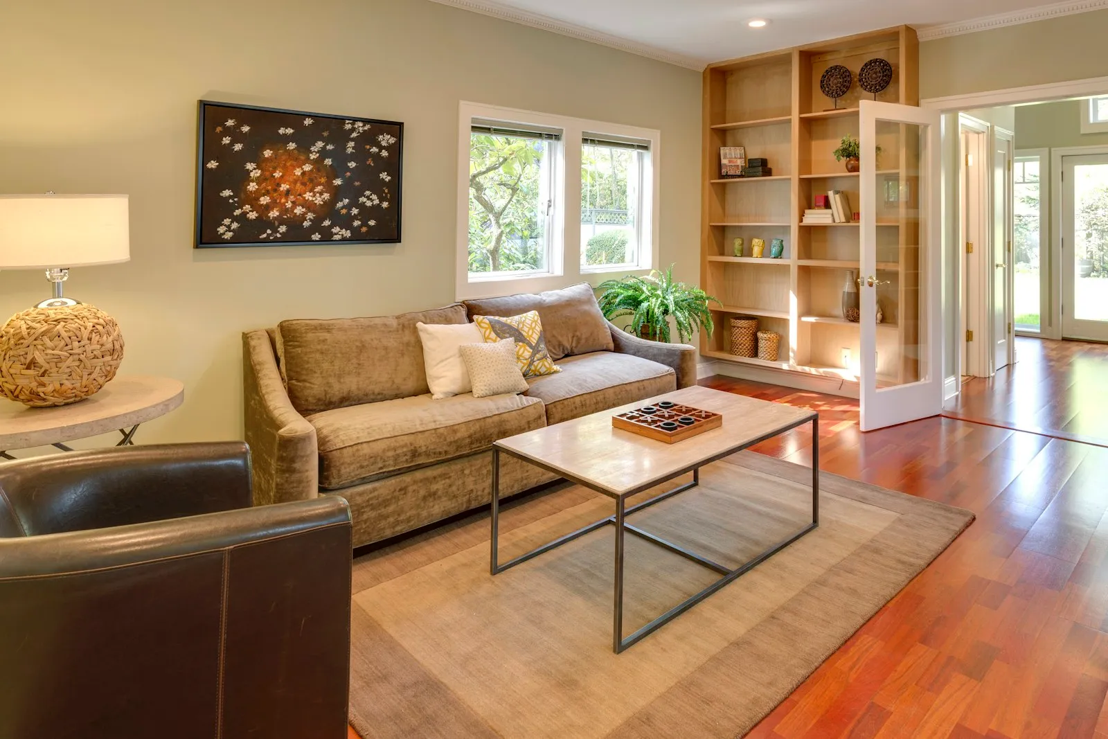 A clean, well-lit living room in a managed unit